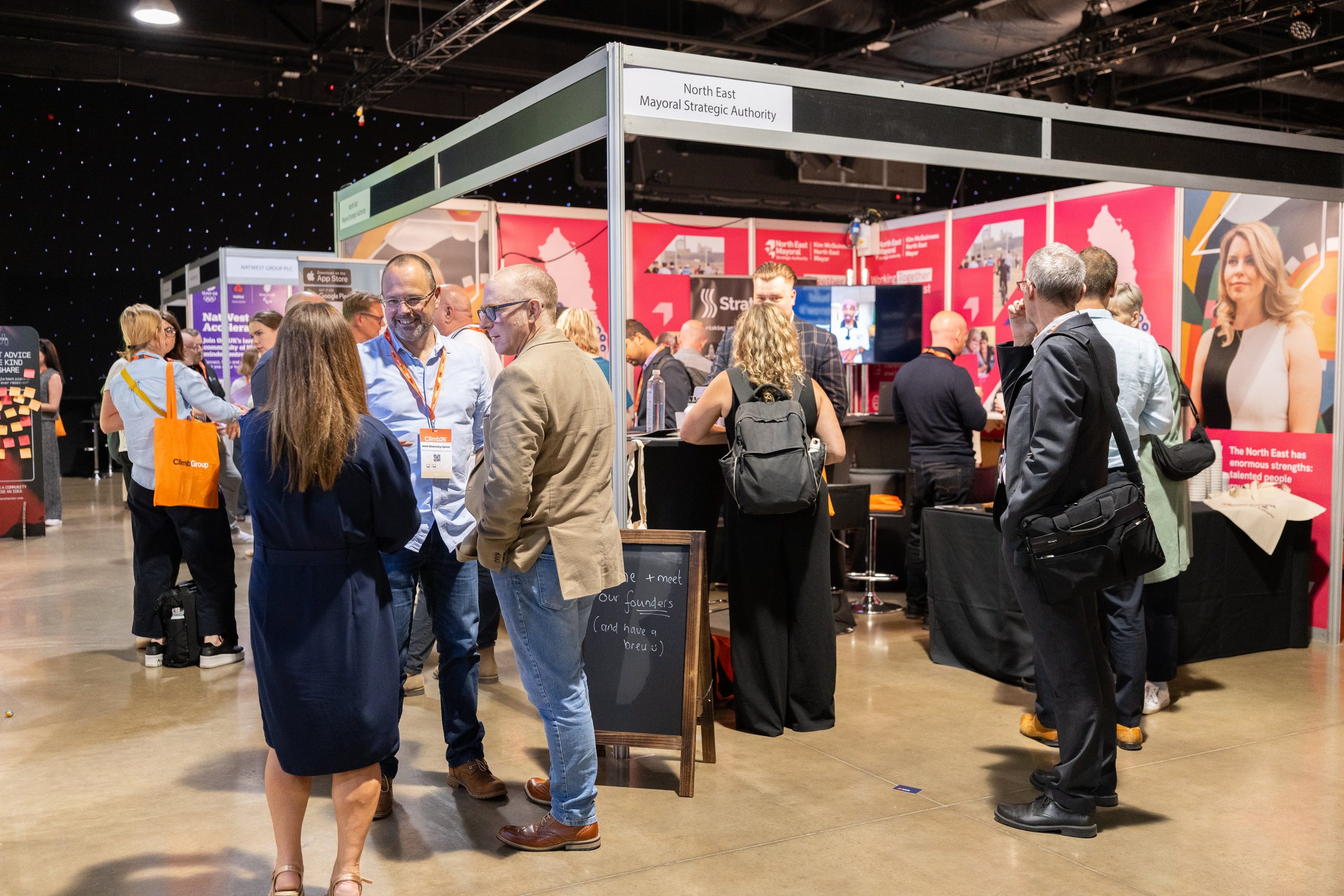 Delegates gathering between busy stands on the expo floor